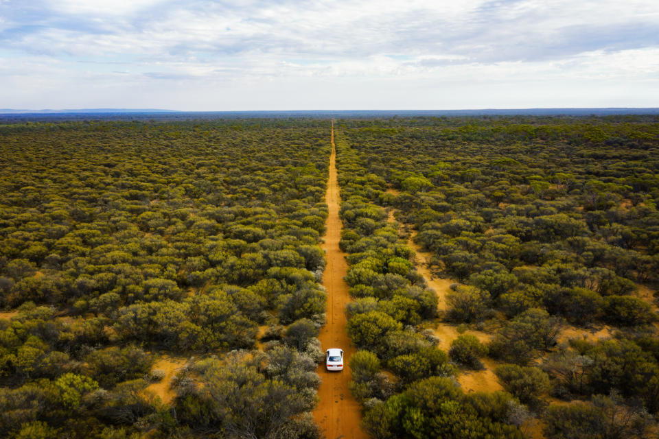 Driving through the bush land in Australian outback, Western Australia