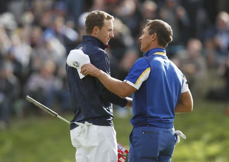 Golf - 2018 Ryder Cup at Le Golf National - Guyancourt, France - September 30, 2018 - Team Europe's Thorbjorn Olesen shakes hands with Team USA's Jordan Spieth during the Singles REUTERS/Paul Childs