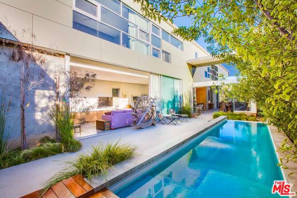 <p>The backyard boasts a 30-foot pool and a patio area. (Zillow) </p>