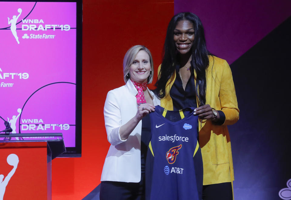 Mississippi State's Teaira McCowan, right, poses for a photo with WNBA COO Christy Hedgpeth after being selected by the Indiana Fever as the third overall pick in the WNBA basketball draft, Wednesday, April 10, 2019, in New York. (AP Photo/Julie Jacobson)