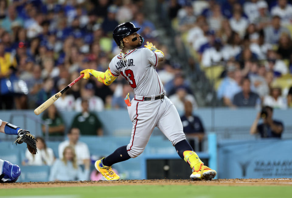 LOS ANGELES, CALIFORNIA - AUGUST 31: Ronald Acuna Jr. #13 of the Atlanta Braves hits a grand slam home run against starting pitcher Lance Lynn #35 of the Los Angeles Dodgers during the second inning at Dodger Stadium on August 31, 2023 in Los Angeles, California. (Photo by Kevork Djansezian/Getty Images)