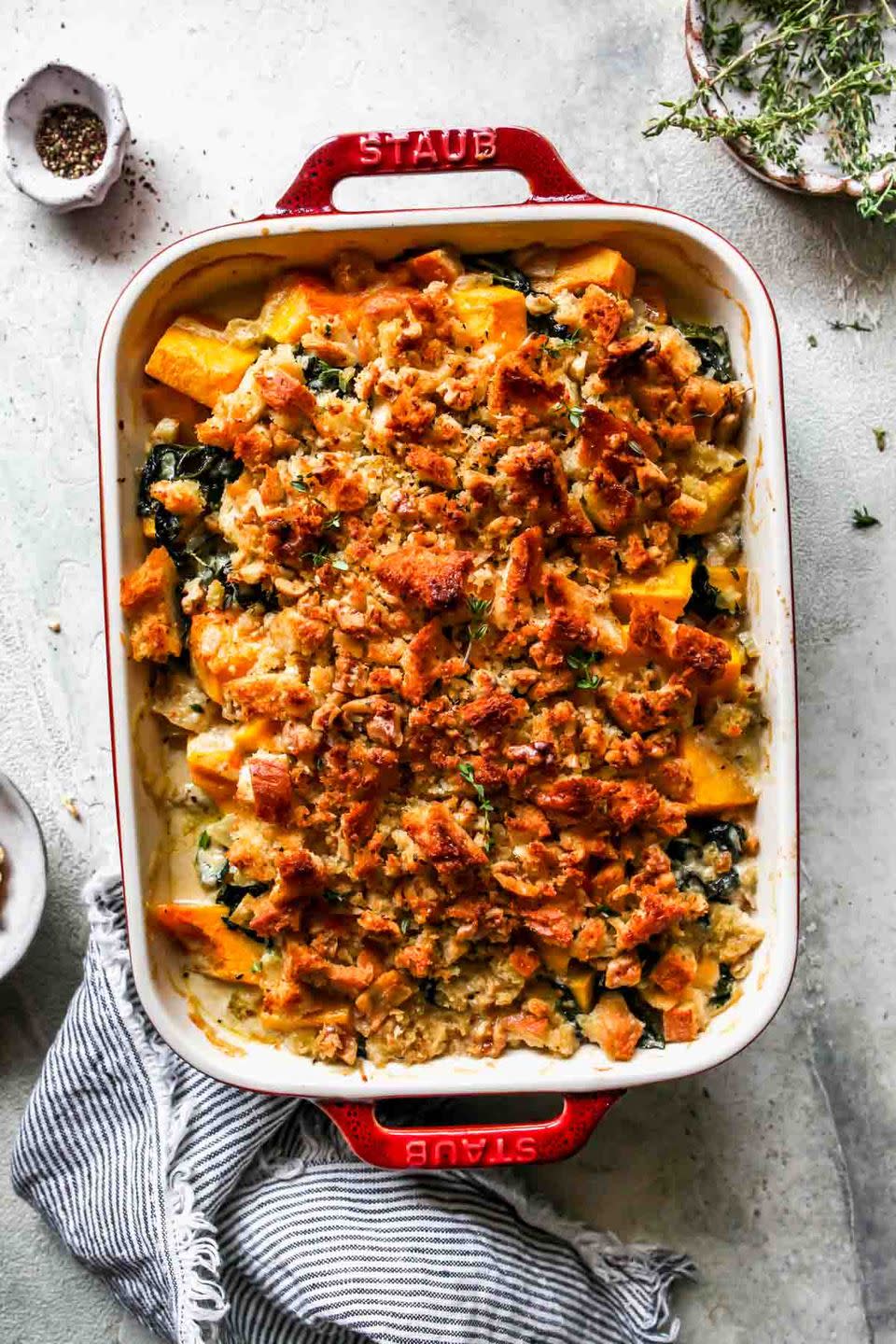 <p>When your fridge seems to be filled with fall veggies like kale and butternut squash, this quick casserole is sure to feed a crowd and taste oh-so-good. It’s savory, creamy, nutty, and cheesy all in one. </p><p><em><a href="https://dishingouthealth.com/butternut-squash-casserole/" rel="nofollow noopener" target="_blank" data-ylk="slk:Get the recipe from Dishing Out Health »;elm:context_link;itc:0;sec:content-canvas" class="link ">Get the recipe from Dishing Out Health »</a></em></p>