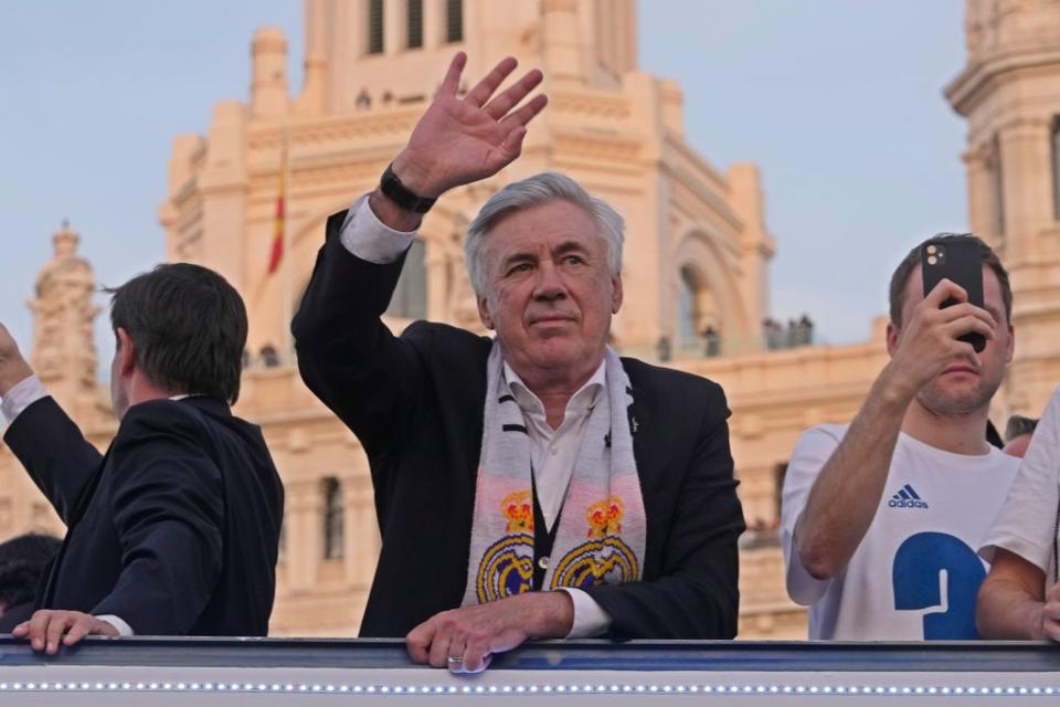 Real Madrid’s head coach Carlo Ancelotti waves during celebrations after Real Madrid won the Spanish title (AP) (AP)