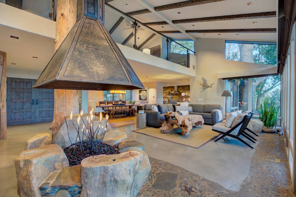 The indoor fire pit was designed to resemble a bonfire at the river’s edge.