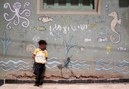 A boy looks on front of his house in Egypt's Nile Delta village of El Shakhluba, in the province of Kafr el-Sheikh, Egypt May 5, 2019. Picture taken May 5, 2019. REUTERS/Hayam Adel