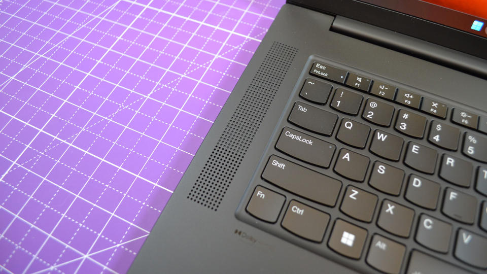 A Lenovo ThinkPad P1 Gen 6 on a table with a purple desk mat underneath