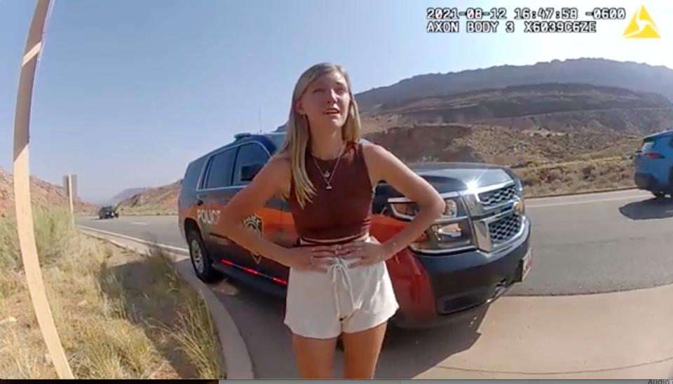 In this image taken from police body camera video provided by the Moab Police Department, Gabrielle Petito talks to a police officer after police pulled over the van she was traveling in with her boyfriend, Brian Laundrie, near the entrance to Arches National Park on Aug. 12, 2021 (MPD)