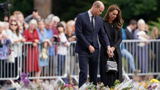 PHOTO: Prince William and the Princess of Wales view floral tributes to late Queen Elizabeth II left by members of the public at the gates of Sandringham House in Norfolk, Sept. 15, 2022. (Joe Giddens/PA via AP)