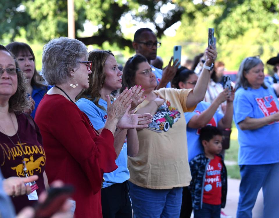 Crowd attendees clap and take videos during the school closing ceremony of Hirschi High School in Wichita Falls on Wednesday, May 15, 2024.