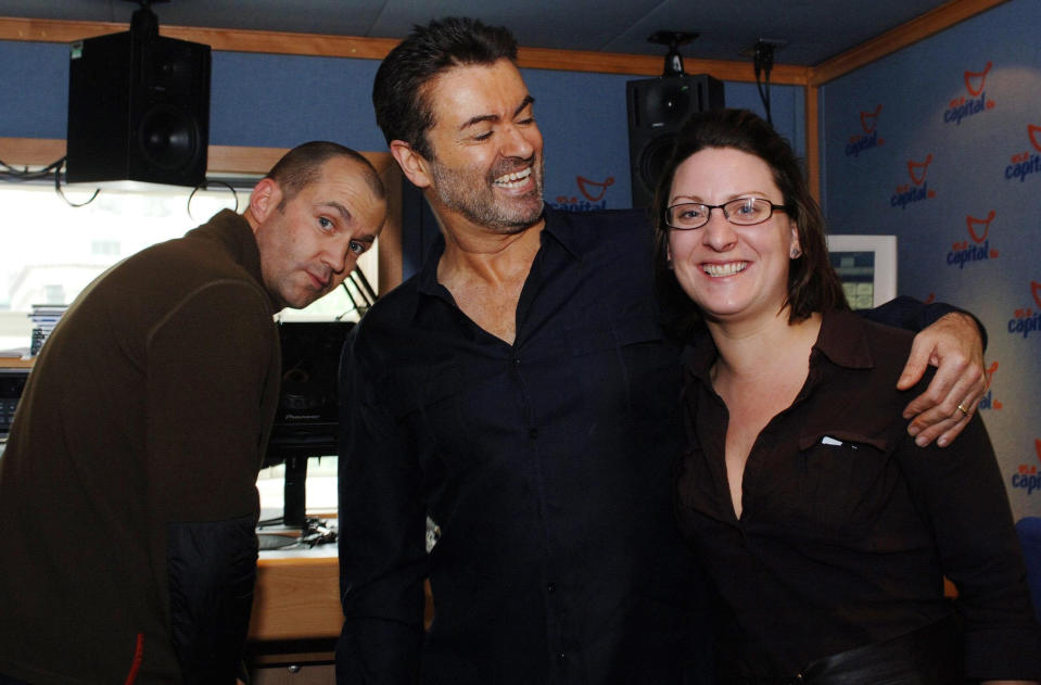 Capital radio presenters Johnny Vaughn (left) and Zoe Hanson with George Michael after the singer interviewed Vaughn for Help a London Child.