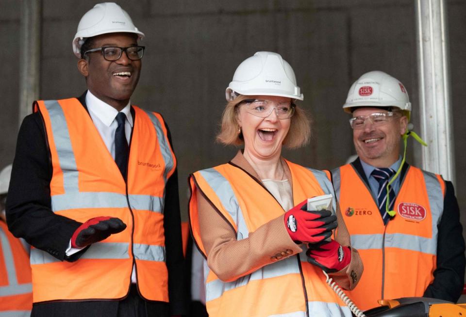 4 October 2022: Prime Minister Liz Truss and Britain’s Chancellor of the Exchequer Kwasi Kwarteng wearing hard hats and hi-vis jackets, visit a construction site for a medical innovation campus in Birmingham (AFP/Getty)