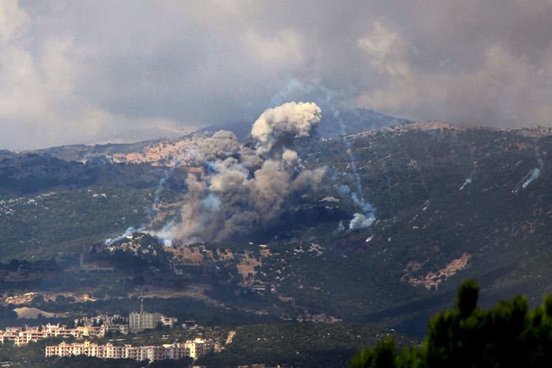 Heavy smoke from Israeli airstrikes rises from a suspected Hezbollah position in the southern Lebanese village of Mahmoudieh. Israeli warplanes carried out more than 50 strikes on several villages in one day after a deadly attack on the southern Beirut suburb that killed 31 people, including Hezbollah commanders from the elite al-Radwan Brigade. Marwan Naamani/dpa