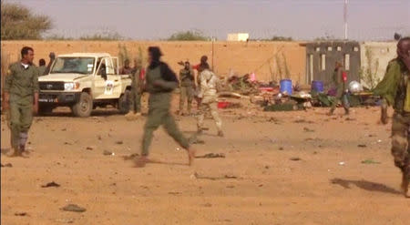 A view of damage after a suicide car bomb attack on a military camp in Gao, Mali January 18, 2017 in this still image taken from video. REUTERS/via Reuters TV