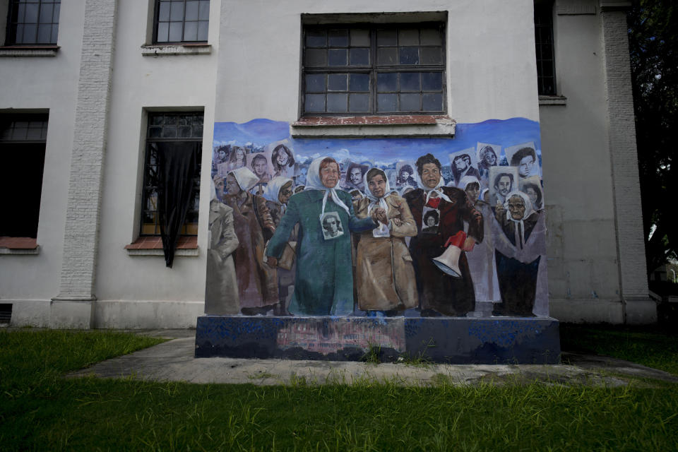 A mural of the Mothers of Plaza de Mayo, whose children disappeared during the military dictatorship (1976 - 1983), covers a wall at the Museum of Space for Memory and the Promotion and Defense of Human Rights (ESMA) in Buenos Aires, Argentina, Tuesday, March 19, 2024. The ESMA was once the Navy School of Mechanics and housed the most infamous illegal detention center during the dictatorship. (AP Photo/Natacha Pisarenko)
