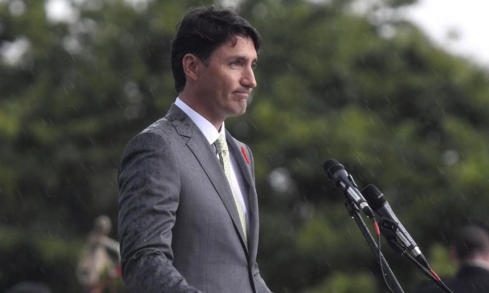 Canadian prime minister Justin Trudeau is rained on as he speaks at a ceremony in Dieppe in 2017.