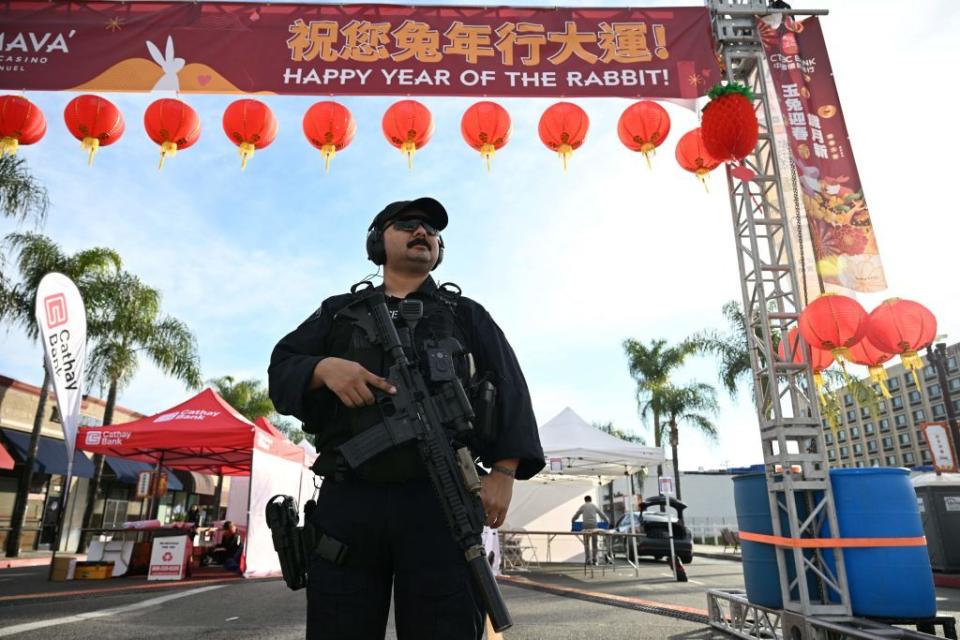 monterey park police officers stand at the scene of a mass shooting in monterey park, california, on january 22, 2023 ten people have died and at least 10 others have been wounded in a mass shooting in a largely asian city in southern california, police said, with the suspect still at large hours later photo by robyn beck afp photo by robyn beckafp via getty images