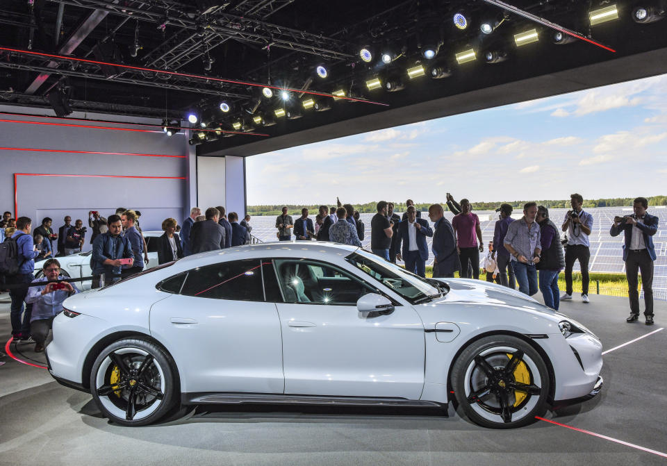 The Porsche Taycan, the first purely electric driven car of the German car maker, is present during a world premier event at the airport Neuhardenberg, about 70 kilometers (45 miles) east of Berlin, Wednesday, Sept. 4, 2019. (Patrick Pleul/dpa via AP)