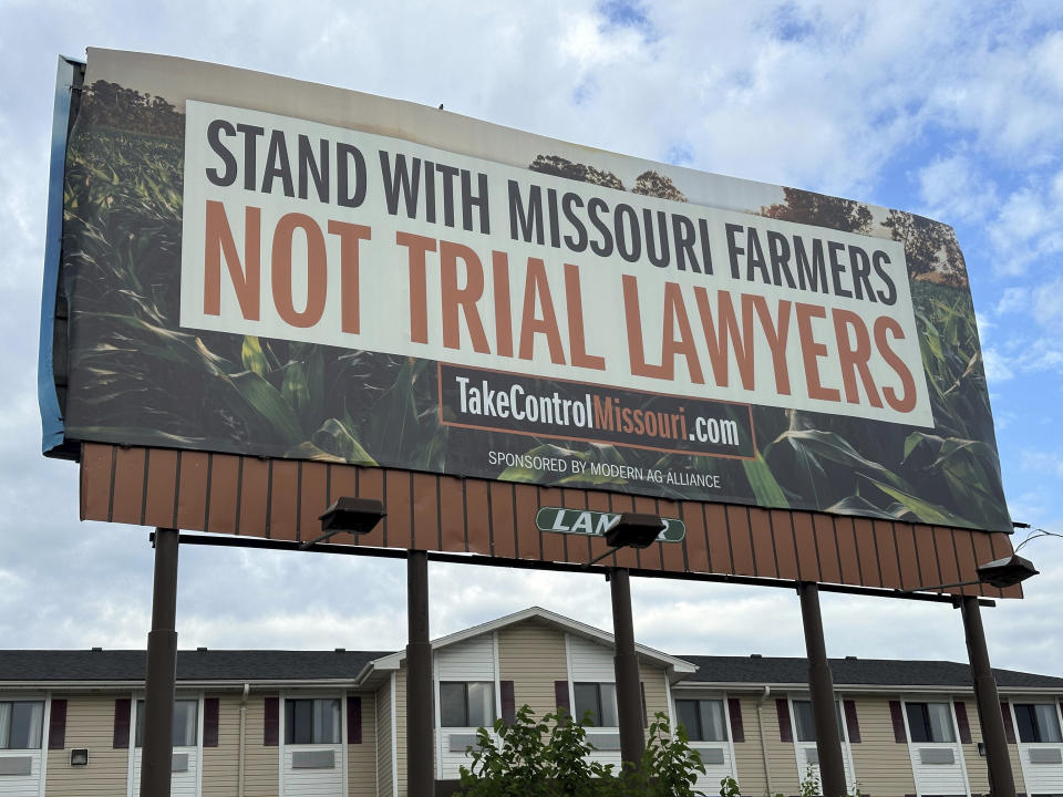 A billboard supporting legislation that would provide legal protection to manufacturers of pesticides such as Bayer's popular weedkiller Roundup, is shown in Jefferson City, Mo., on May 13, 2024. (AP Photo/David A. Lieb)