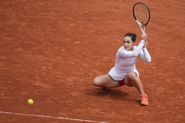 Italy's Martina Trevisan plays a shot against Aliaksandra Sasnovich of Belarus during their fourth round match at the French Open tennis tournament in Roland Garros stadium in Paris, France, Sunday, May 29, 2022. (AP Photo/Christophe Ena)