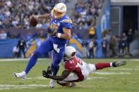 Nov 25, 2018; Carson, CA, USA; Los Angeles Chargers quarterback Philip Rivers (17) is tackled by Arizona Cardinals linebacker Gerald Hodges (51) during the third quarter at StubHub Center. Mandatory Credit: Jake Roth-USA TODAY Sports