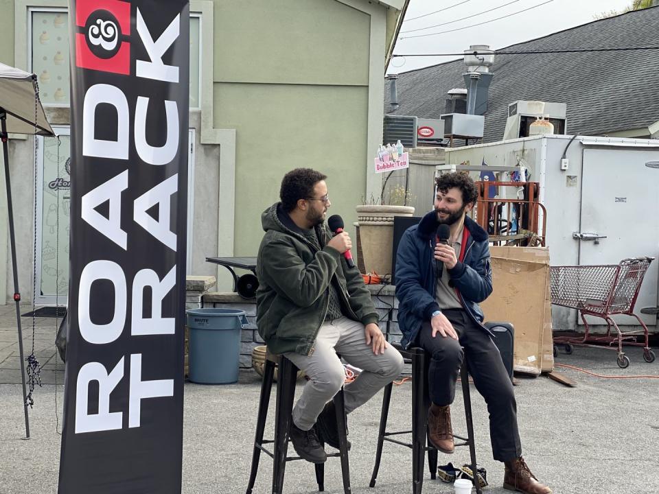 a couple of men sitting in chairs