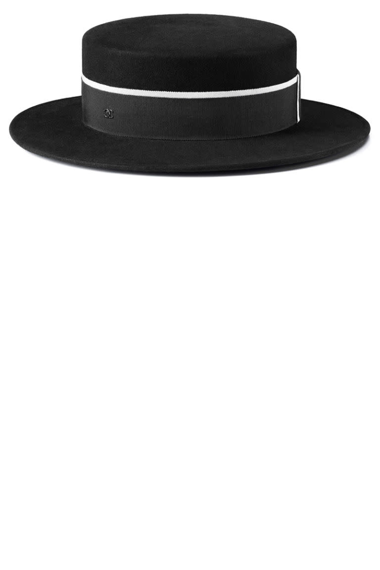 <p><strong>Chanel</strong> hat, $975, <a rel="nofollow noopener" href="http://www.chanel.com/en_US/fashion/products/hats/s.boater-felt-grosgrain-black.16B.A76302X1048094305.c.16B.html" target="_blank" data-ylk="slk:chanel.com;elm:context_link;itc:0;sec:content-canvas" class="link ">chanel.com</a>. </p>