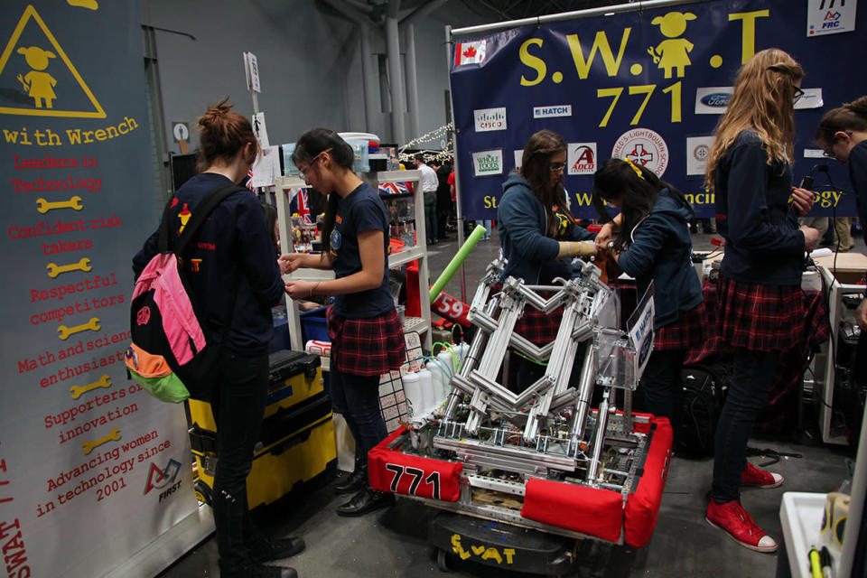Robotics team of St. Mildred's Women Advancing Technology (S.W.AT 771) in their pit.