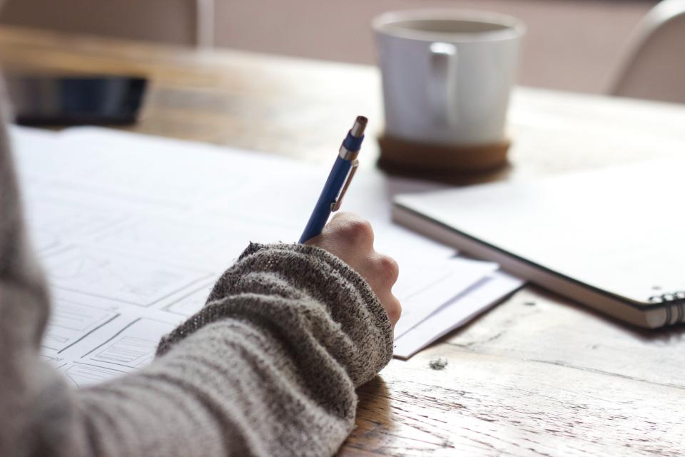 Setting up a work station will make you more productive than working from bed or the couch. (Green Chameleon/Unsplash)