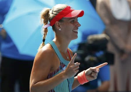 Germany's Angelique Kerber celebrates after winning her semi-final match against Britain's Johanna Konta at the Australian Open tennis tournament at Melbourne Park, Australia, January 28, 2016. REUTERS/Thomas Peter