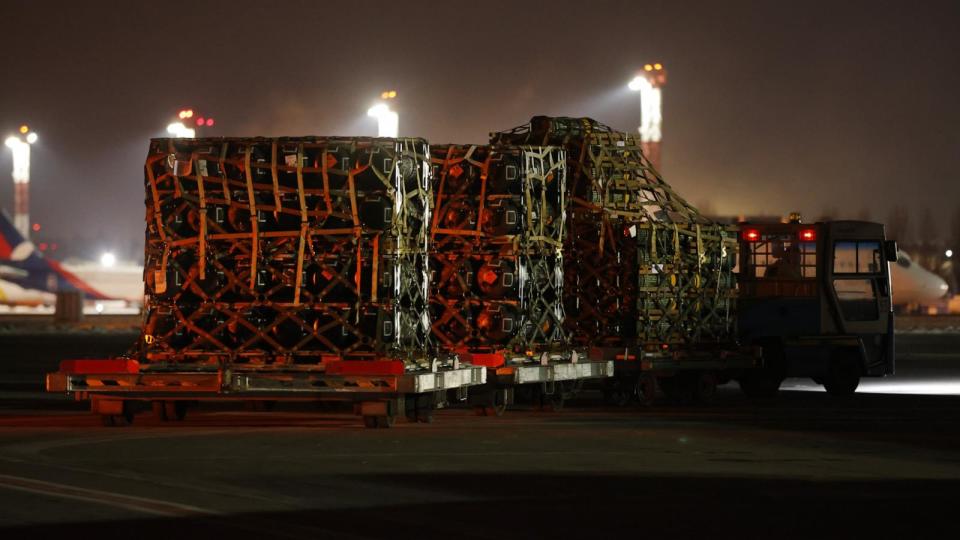 PHOTO: An airport vehicle pulls a portion of a shipment of weapons that include Javelin anti-tank missiles and other military hardware delivered on a National Airlines plane by the U.S. military at Boryspil Airport, Jan. 25, 2022, in Boryspil, Ukraine.  (Sean Gallup/Getty Images, FILE)