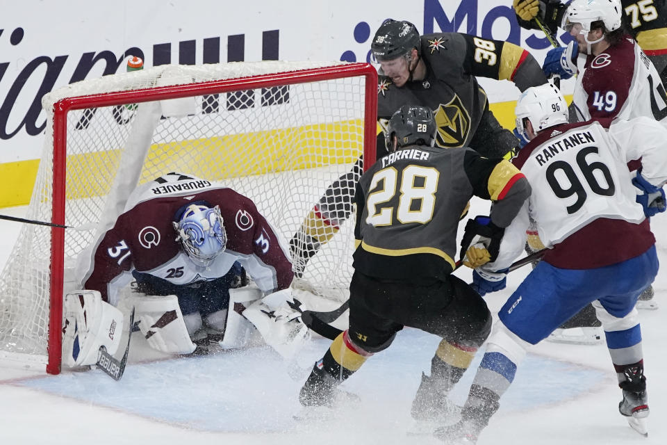 Vegas Golden Knights center Patrick Brown (38) scores a goal against Colorado Avalanche goaltender Philipp Grubauer (31) during the third period in Game 4 of an NHL hockey Stanley Cup second-round playoff series Sunday, June 6, 2021, in Las Vegas. (AP Photo/John Locher)