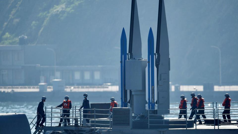 a pair of standard surface to air missiles on a mk 26 twin arm missile launcher