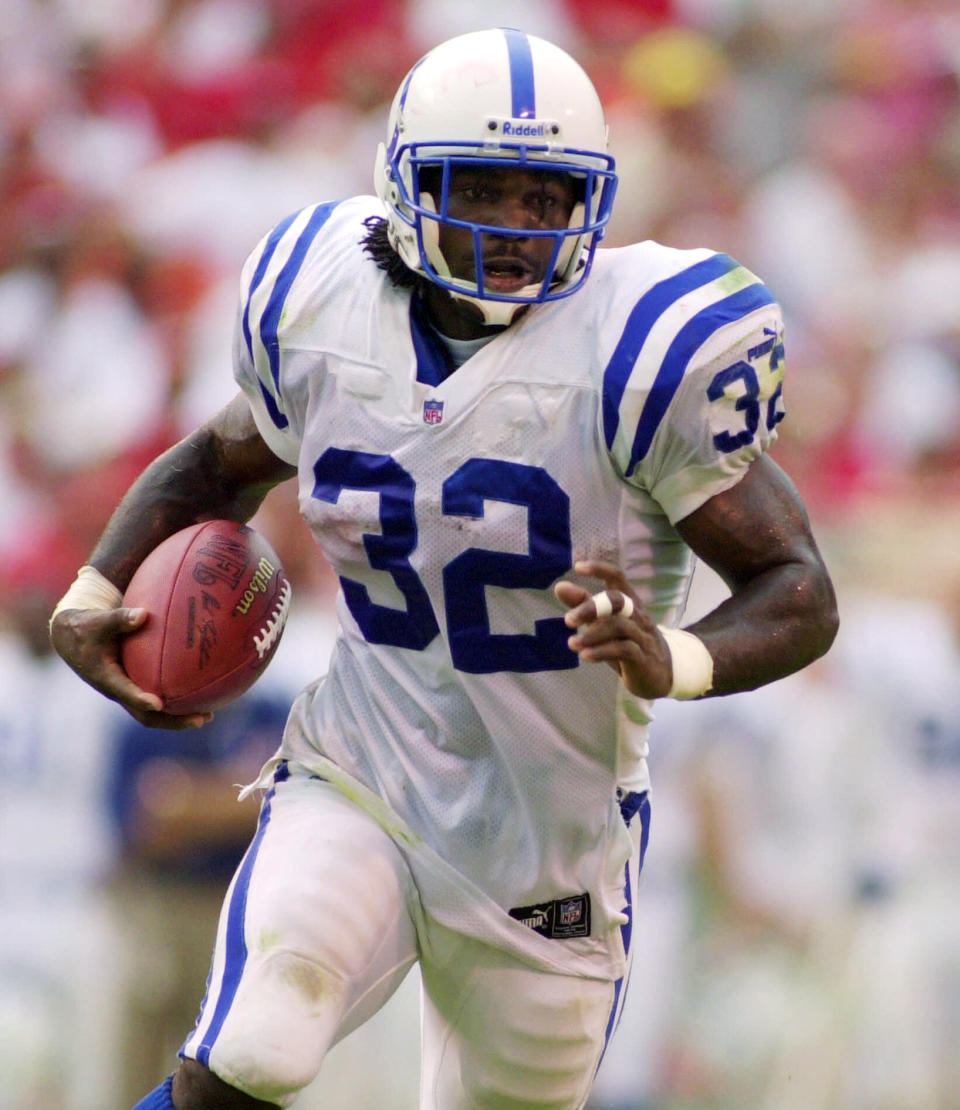 FILE - In this Sept. 3, 2000, file photo, Indianapolis Colts running back Edgerrin James (32) takes a pass from quarterback Peyton Manning 27 yards for a touchdown during the third quarter of their NFL football game against the Kansas City Chiefs in Kansas City, Mo. The man drafted fourth overall in 1999 — ahead of Heisman Trophy winner Ricky Williams and as the hand-picked replacement for Marshall Faulk — carved out his own Hall of Fame career with a gritty work ethic, a freewheeling personality and a commitment to stay true to his roots.(AP Photo/Ed Zurga, File)