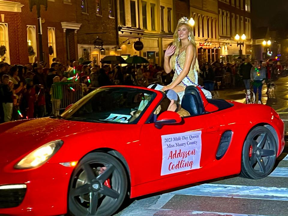 The 2023 Miss Maury County Mule Day Queen Addyson Codling makes her way down the parade route during the 37th annual Columbia Main Street Christmas Parade.