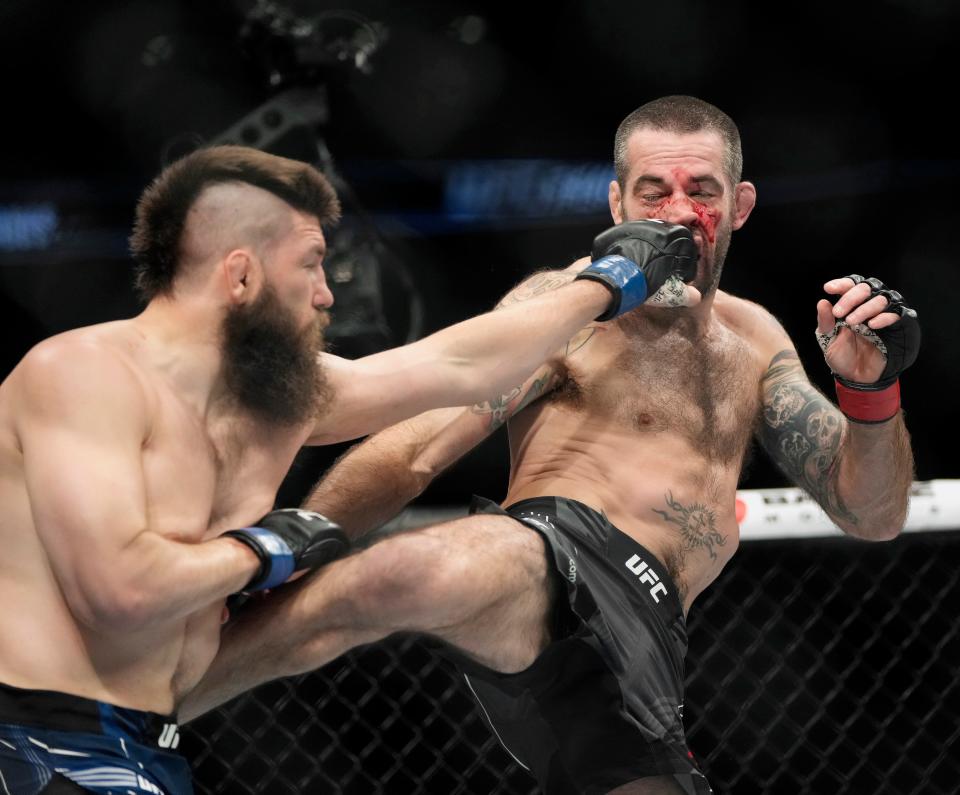 Bryan Barberena, left, defeated Matt Brown, right, by split decision in a three-round welterweight bout during UFC Fight Night at Nationwide Arena in Columbus on Saturday.