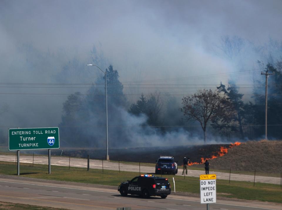 Fire near the entrance to the Turner Turnpike. Wildfires in Northeast Oklahoma City Friday, March 31, 2023