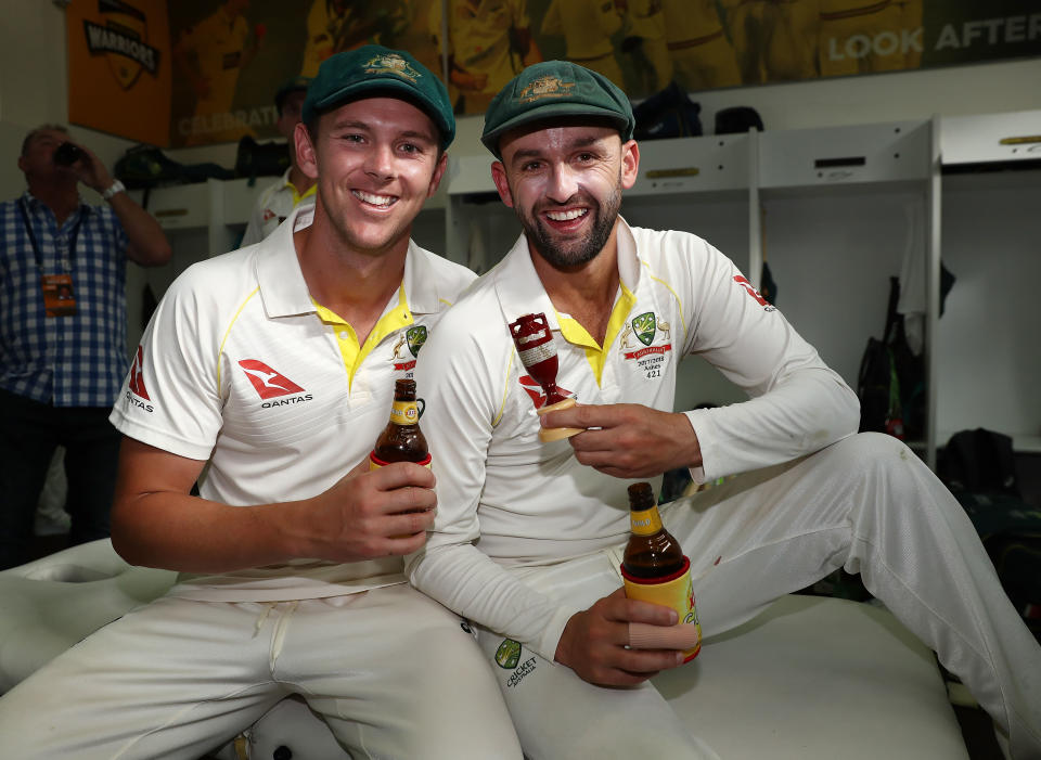 Lyon shows off his Ashes prize. Pic: Getty