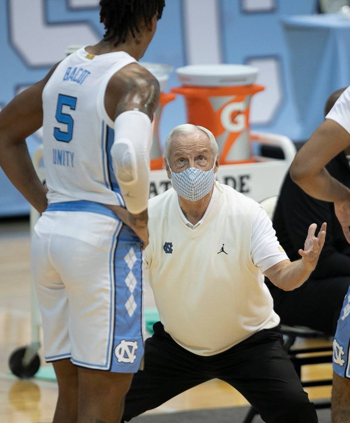 North Carolina coach Roy Williams has a word with Armando Bacot (5) during a time out in the second half against NCCU on Saturday, December 12, 2020 at the Smith Center in Chapel Hill, N.C.