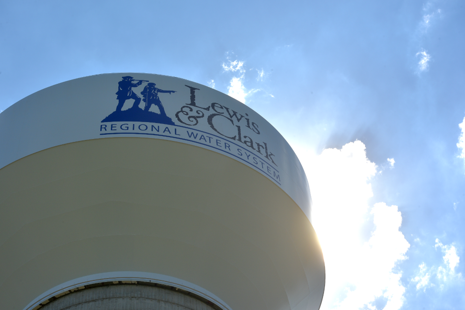 Sunlight peaks around the steel tank atop the Beresford water tower on Wednesday, Aug. 10, 2022.  The 2,500,000 gallon storage tank is part of the Lewis & Clark Regional Water System, which took a multi-state, bipartisan effort to fund and complete.