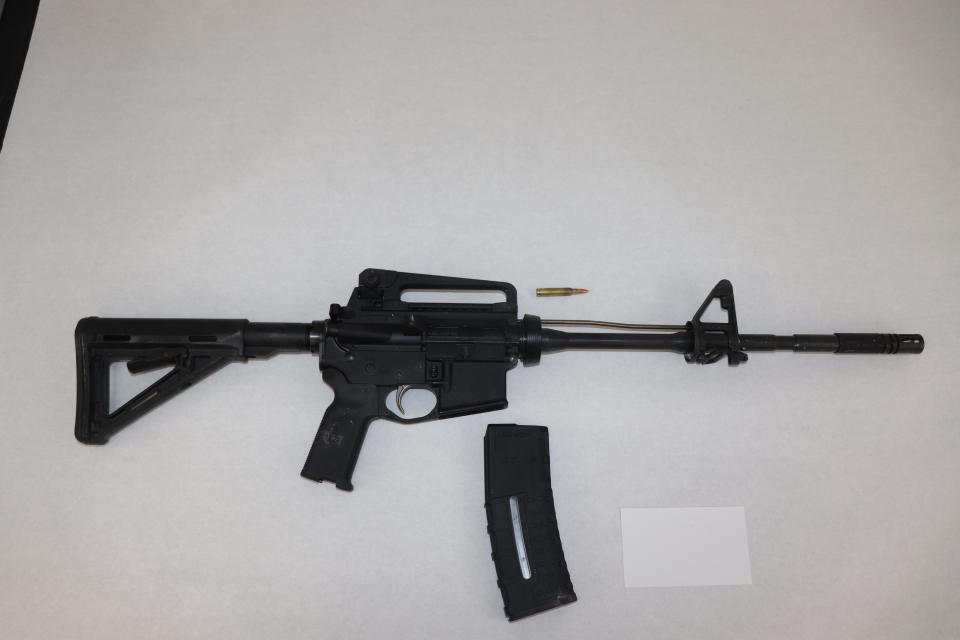 This image provided by the St. Louis Metropolitan Police Department shows an AR-15-style rifle used by a 19-year-old gunman who killed a teacher and a 15-year-old girl at a St. Louis high school on Monday, Oct. 24, 2022. The gunman was armed with an AR-15-style rifle and what appeared to be more than 600 rounds of ammunition, Police Commissioner Michael Sack said Tuesday, Oct. 25, 2022. (St. Louis Metropolitan Police Department via AP)