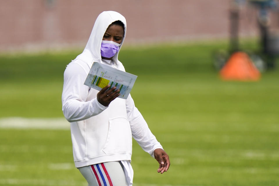 New York Giants running back Saquon Barkley studies a chart at NFL football training camp, Wednesday, July 28, 2021, in East Rutherford, N.J. (AP Photo/Corey Sipkin)