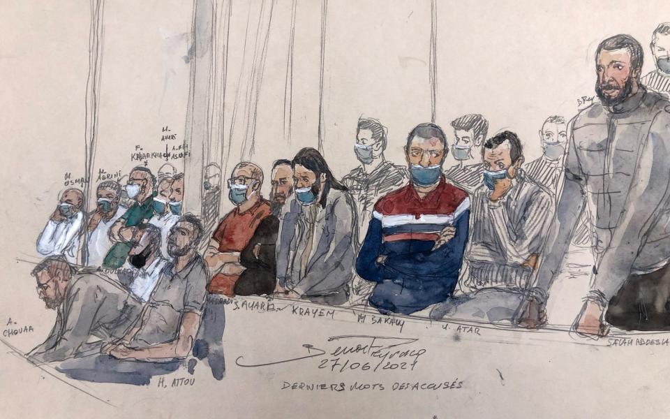 A court sketch shows Abdeslam standing next to the 13 other defendants - BENOIT PEYRUCQ 