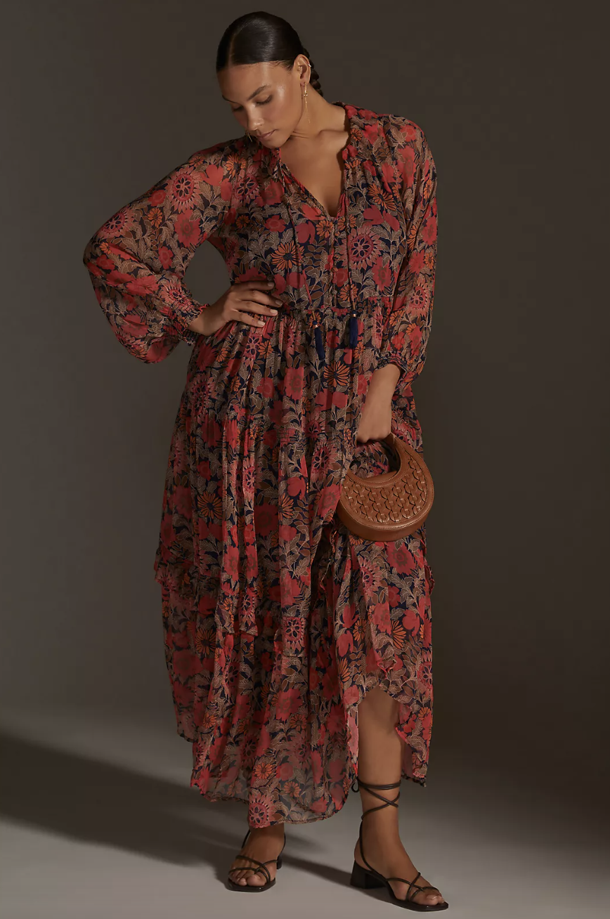 model wearing red floral printed maxi dress, The Marais Printed Chiffon Maxi Dress in red motif (Photo via Anthropologie)