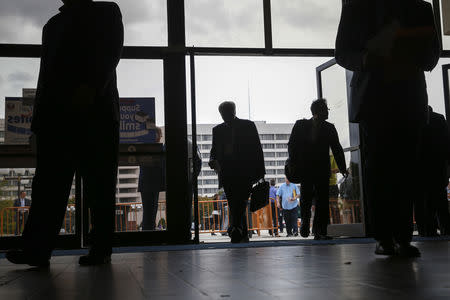 FILE PHOTO: People enter the Nassau County Mega Job Fair at Nassau Veterans Memorial Coliseum in Uniondale, New York October 7, 2014. REUTERS/Shannon Stapleton