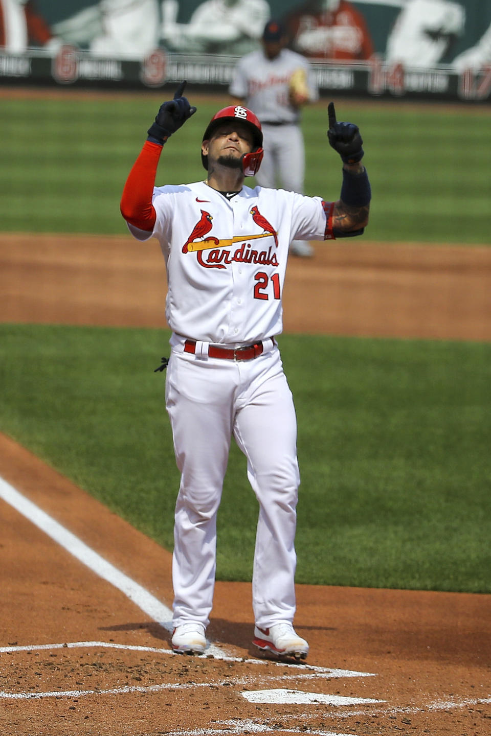 St. Louis Cardinals' Yadier Molina gestures skyward after hitting a two-run home run during the second inning in the first game of a baseball doubleheader against the Detroit Tigers Thursday, Sept. 10, 2020, in St. Louis. Molina is wearing the number 21 in honor of Roberto Clemente. (AP Photo/Scott Kane)