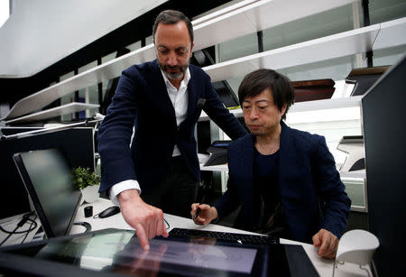 Infiniti, Nissan Motor's premium brand, Executive Design Director Karim Habib (L) looks at a monitior with Creative Design Manager Hideo Komuro at its Global Design Center in Atsugi, Japan, April 18, 2018. Picture taken April 18, 2018. REUTERS/Toru Hanai