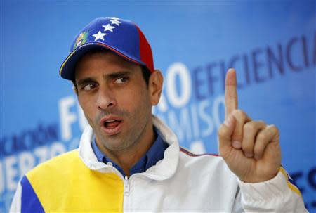 Miranda's state governor and opposition leader Henrique Capriles speaks during an interview with Reuters in Caracas February 26, 2014. REUTERS/Marco Bello