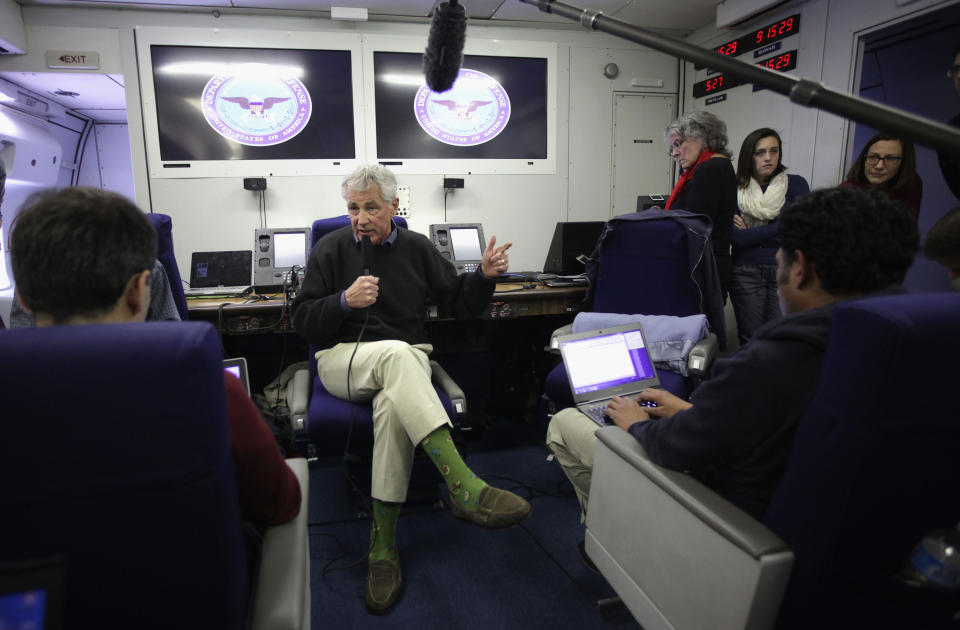 U.S. Secretary of Defense Chuck Hagel speaks to members of a travel press pool April 1, 2014 en route Honolulu, Hawaii. The U.S. is likely to move a warship into the Black Sea and send a small team of soldiers to Europe as part of NATO's effort to bolster allies in Eastern Europe who are worried about Russia's military annexation of Crimea. That from a senior defense official. Hagel says this country has "to be prepared to deal with any contingency and all options." (AP Photo/Alex Wong, Pool)