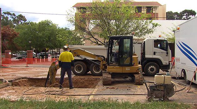 Workers repair the main on South Tce that has caused problems for patients and staff at St Andrews Hospital. Photo: 7News.