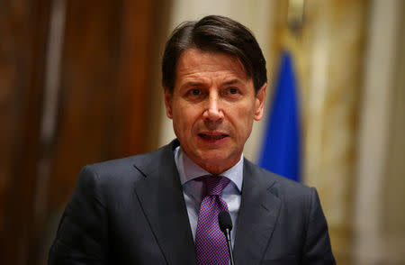 FILE PHOTO: Italy's newly appointed Prime Minister Giuseppe Conte speaks at the media at the end of a round of consultations with political parties at the Lower House in Rome, Italy, May 24, 2018. REUTERS/Tony Gentile/File Photo